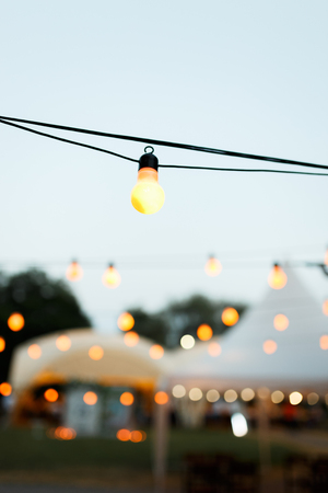warm light bulbs at the evening eventの写真素材