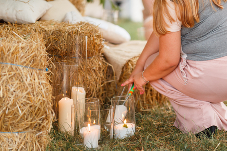 Beautiful burning candles in glass transparent vases. Intimate romantic atmosphere, burning candlesの写真素材
