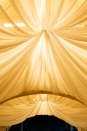 beautifully decorated wedding tent and wedding banquet on a background of skyの写真素材