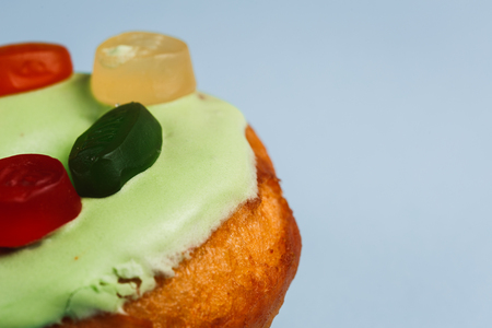 Donut with green glaze and colour marmaladeの写真素材