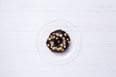 donut in sugar glaze on transparent plateの写真素材