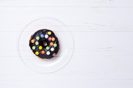 donut in sugar glaze on transparent plateの写真素材