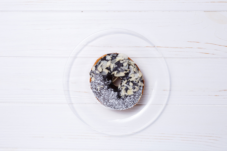 donut in sugar glaze on transparent plateの写真素材