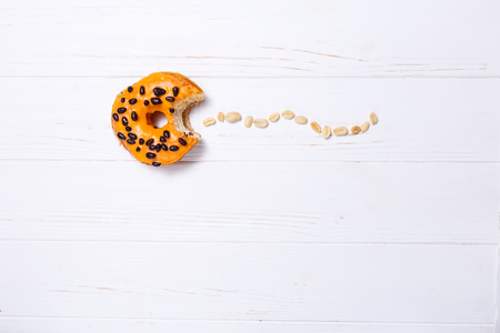 Orange donut Pac-Man in sugar glaze on a transparent plateの写真素材