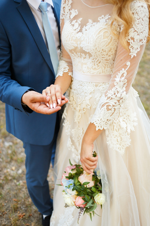Hands of the lovers of the bride and groom. Wedding ringsの写真素材