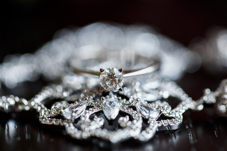 A pair of wedding rings with bokeh backgroundの写真素材