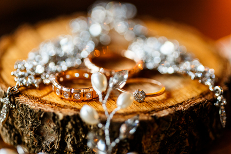 A pair of wedding rings with bokeh backgroundの写真素材