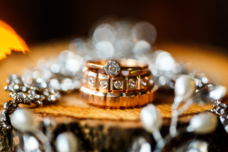 A pair of wedding rings with bokeh backgroundの写真素材
