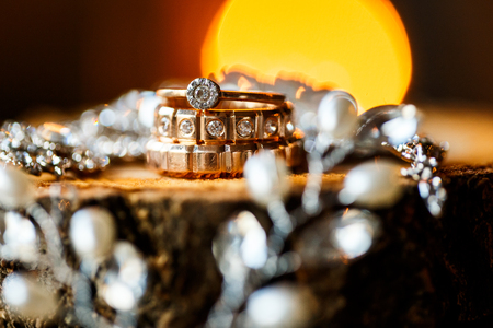 A pair of wedding rings with bokeh backgroundの写真素材