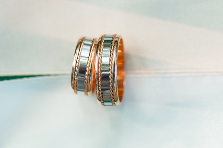 Engagement wedding golden and silver rings with patternの写真素材
