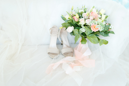 Beautiful and delicate wedding bouquet of flowers and roses of David Austin for the brideの写真素材