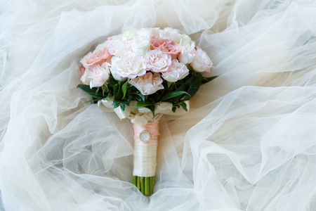 Beautiful and delicate wedding bouquet of flowers and roses of David Austin for the brideの写真素材