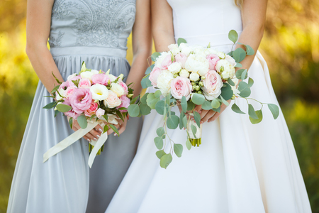 Beautiful and delicate wedding bouquet of flowers and roses of David Austin for the brideの写真素材