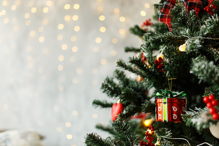 Christmas Balls And Decorations On A Beautiful Christmas Tree. Decorated New Year's Interior. Place For Text.の写真素材