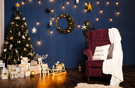 Christmas background. Festive abstract background with bokeh defocused lights and starsの写真素材