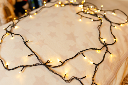 Christmas background. Festive abstract background with bokeh defocused lights and starsの写真素材