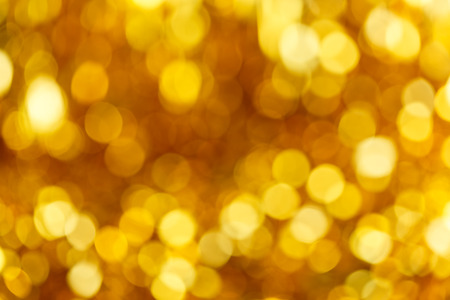 Golden bokeh glitter texture christmas abstract background. Bokeh christmas blinking lights.の写真素材