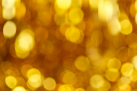 Golden bokeh glitter texture christmas abstract background. Bokeh christmas blinking lights.の写真素材