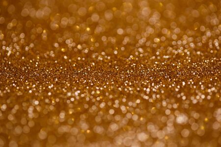 Golden bokeh glitter texture christmas abstractの写真素材