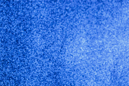 Electric blue bokeh glitter texture christmas abstract background. Neon bokeh christmas lights.の写真素材
