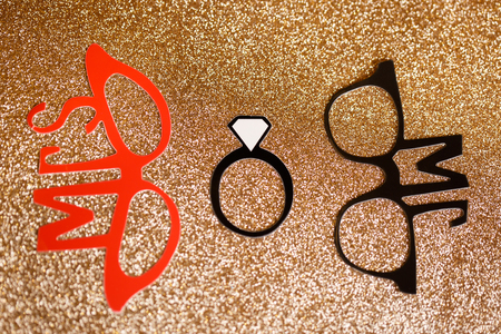 Paper accessories for holidays, birthday, parties, carnival and wedding celebration concept. Accessories for photobooths photoshooting on golden glitter background.の写真素材