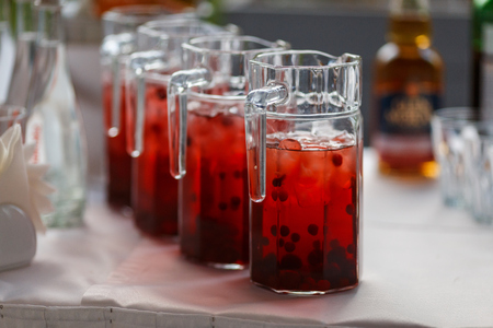 Decanters with cranberry lemonade and iceの写真素材
