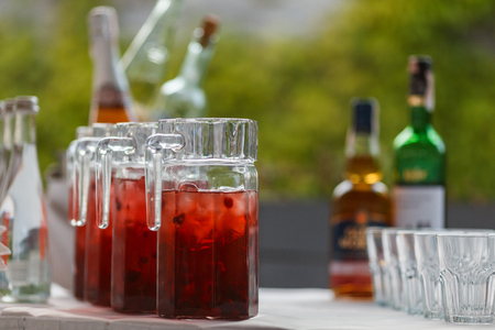 Decanters with cranberry lemonade and iceの写真素材