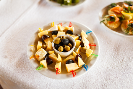 Delicious Canapes snacks with cheese on the buffet table. Party Snacks.の写真素材