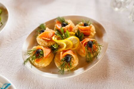 Delicious Canapes snacks with cheese on the buffet table.の写真素材