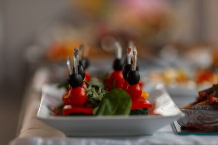Delicious Canapes snacks with cheese on the buffet table.の写真素材