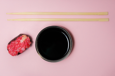 Japanese food Ebiko Gunganmaki. Shrimp roe gunship roll isolated on pink background.の写真素材