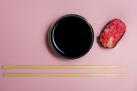 Japanese food Ebiko Gunganmaki. Shrimp roe gunship roll isolated on pink background.の写真素材