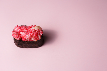 Japanese food Ebiko Gunganmaki. Shrimp roe gunship roll isolated on pink background.の写真素材