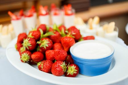 Strawberry with chantilly in white plate on a partyの写真素材