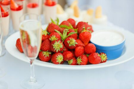 Strawberry with chantilly in white plate on a partyの写真素材