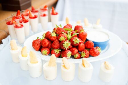 Strawberry with chantilly in white plate on a partyの写真素材