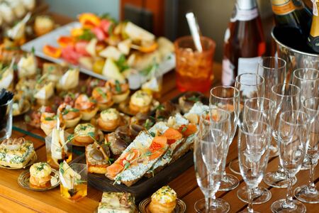 Catering Fourchette, buffet table, Canape, sandwiches and snacks on holiday tableの写真素材