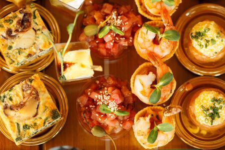 Catering Fourchette, buffet table, Canape, sandwiches and snacks on holiday tableの写真素材