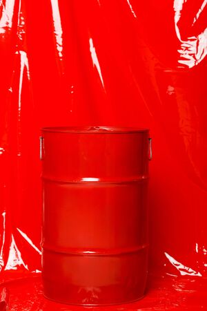 Red barrel on a red latex backgroundの写真素材