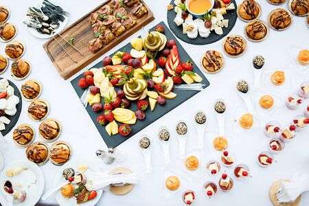 Snacks and canapes on the holiday tableの写真素材