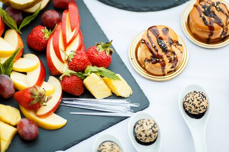 Fresh Sliced fruits on the holiday tableの写真素材