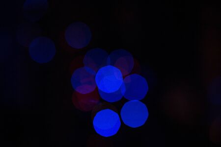 christmas background, image blur bokeh defocused lights decoration on christmas tree at night.の写真素材