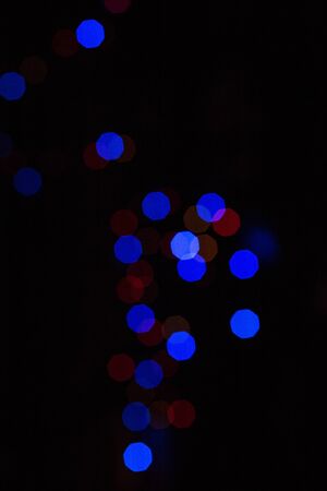 christmas background, image blur bokeh defocused lights decoration on christmas tree at night.の写真素材