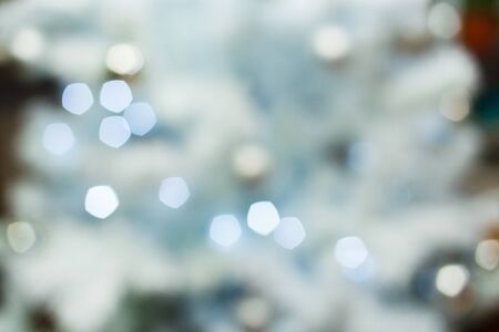 christmas background, image blur bokeh defocused lights decoration on christmas tree at night.の写真素材
