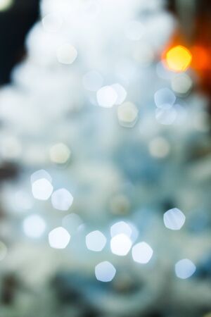 christmas background, image blur bokeh defocused lights decoration on christmas tree at night.の写真素材