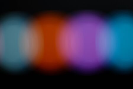 Purple, blue and red Christmas background with lights out of focus. bokeh. defocus.の写真素材