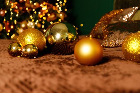 Golden Christmas Balls And Decorations From A Beautiful Christmas Tree. Decorated Christmas Interior in golden colour. Place For Text.の写真素材