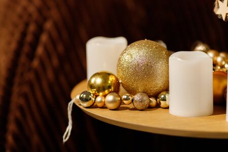 Golden Christmas Balls And Decorations From A Beautiful Christmas Tree. Decorated Christmas Interior in golden colour. Place For Text.の写真素材