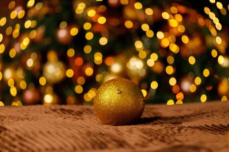 Golden Christmas Balls And Decorations From A Beautiful Christmas Tree. Decorated Christmas Interior in golden colour. Place For Text.の写真素材