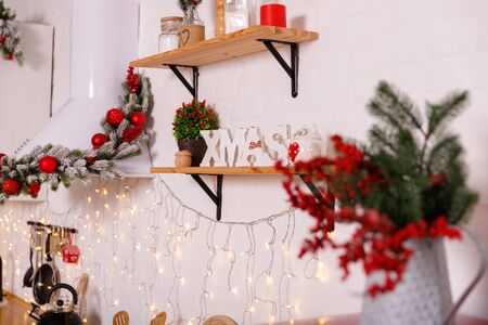 Christmas decorated kithen in loft style. Red colors. Modern loft style of interior dacorated for New Year Eveの写真素材